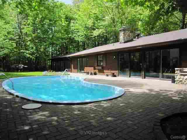 HOME OF DREAM ENCIRCLED WITH A SPLENDID WOODED GROUND (SAINT JEAN SUR RICHELIEU)