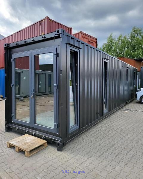 Modified 40ft container with glass doors, windows, and bathroom