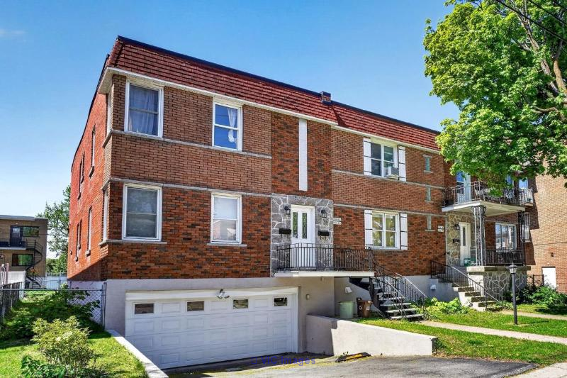 RARE OPPORTUNITY IN AHUNTSIC — DETACHED FOURPLEX WITH 4 GARAGES